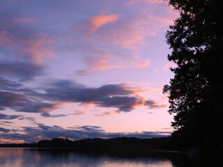 Wall Mural - serene sunset lake with vibrant clouds