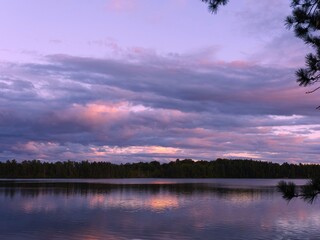 Wall Mural - tranquil lake sunset with reflective clouds