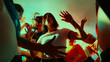 © master1305 - Low-angle view of people dancing energetically with colorful lighting creating a vibrant atmosphere. Concept of nightlife, party, youth, summer, festivity, celebration.