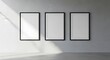 © MdMasud - Minimalist Wall Art Mockup Featuring Three Black Framed Posters in a Modern Room with Natural Light and Clean Lines