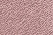 © top images - Close-up of pink textured leather surface with visible grain pattern