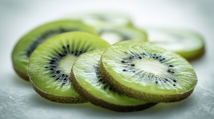 Wall Mural - The vibrant kiwi slices arranged beautifully on a light background.