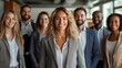 © roman - Group of confident smiling business professionals in modern office, team photo with professional attire against white background
