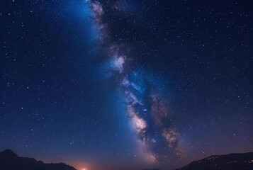 Wall Mural - Milky Way galaxy over a mountain silhouette at night