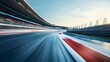 © florynstudio3 - Fast race track with blurred motion effect, showing a turn with stands and crowd.