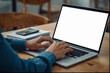 © zaffii - Close‑up of hands typing on laptop keyboard in home workspace |  home office | blank screen for text mockup |  remote/freelance | modern office workspace | corporate/office