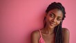 © Oleksandr - Portrait of a smiling young woman with dark braided hair against a pink background, radiating beauty and confidence.  Minimalist aesthetic.