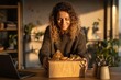 © whitestorm - A joyful woman with curly hair smiles as she opens a delivery box, excited to see what's inside and enjoy a cozy, warm moment in her home office.
