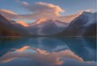 © lia - Glowing mountain sunset reflecting over misty alpine lake. Glowing mountain sunrise reflecting over misty alpine lake
