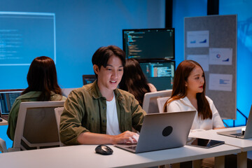 asian software engineer or programmer team working late in development office,problem solving or alg