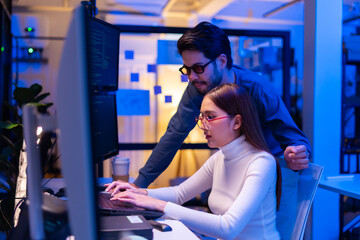 Asian software engineer or programmer team working late in development office,problem solving or algorithm of ai assistant helping for work.software developer,digital technology security concept