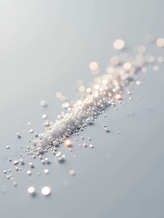 Wall Mural - shimmering silver glitter dust scattered across soft gray background delicate sparkles catching warm light