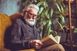 © zetrum - An older man with a white beard sits in a cozy armchair, engrossed in reading a book surrounded by plants.
