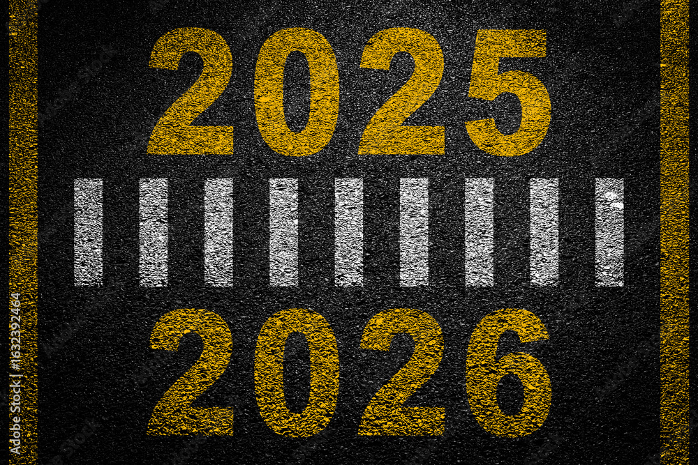 Years 2025 to 2026 on an empty asphalt road leading to the horizon ...