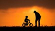 © BaniMakrufah - Silhouette of a father teaching his son to ride a bike at sunset