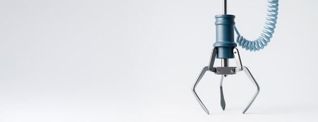 Wall Mural - close-up of robotic claw arm with coiled cable on light background, minimal composition with copy sp