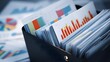 © FS - Reports and financial analysis in an organized box with charts and data for making decisions.