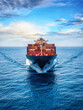 © moofushi - Front view of a loaded container cargo vessel traveling over calm ocean with speed