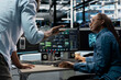 © DC Studio - Server farm teamworking engineers doing brainstorming, looking at data analysis graph to reduce failures. Data center colleagues talking, working together using AI visualization dashboard