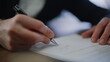 © stockbusters - Businessman hand signing legal agreement at office closeup. Unknown entrepreneur