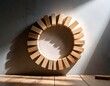 © Wanda - representing steady business, Circular wooden blocks arrangement on a surface, with shadow and light.