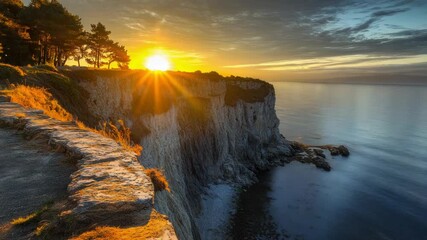 Wall Mural - a scenic view of the ocean from the top of a cliff, with waves crashing against the rocks below