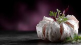 Delicate white meringue dessert with fresh green herbs and purple leaves