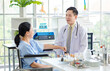 © Bangkok Click Studio - Asian male doctor in white coat with stethoscope, consulting explain medications to senior female patient professional support trust healthcare checkup, insurance treatment wellness in hospital clinic