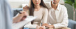 © Pormezz - Spouses relationship consultant concept, Close-up hands of psychologist holding pen and note during therapy talk session for married couple that mental health breakdown and relationship problems.