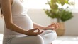 © Faqihan - Calm pregnant woman practicing prenatal yoga and meditation for a healthy lifestyle