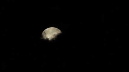Wall Mural - dark clouds moving across night sky revealing a full moon, maffra, gippsland, victoria, australia