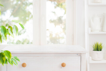 Wall Mural - table top of bleached wooden cabinet for product display montage on blurred kitchen window backgroun