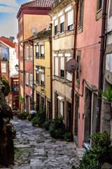 Naklejka na meble Narrow alley with colourful facades in the old town of Porto, Portugal.