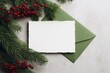 © Rendara Studio - Flatlay Christmas card mockup with green envelope and red berries