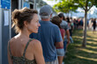 © Milos - A woman stands in line, showcasing determination and patience against a backdrop of people waiting, symbolizing the human experience of anticipation and community interaction.