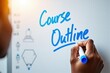 © MSTSAHERA - Teacher Writing 'Course Outline' on Whiteboard