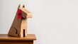 © You are the best - Handmade cardboard dog sculpture with red tag sitting on a wooden surface