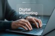 © Hriday - Digital Marketing in Action: A close-up view of a professional engrossed in digital marketing strategies, typing on a laptop with focused concentration, in an office setting.