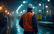 © yang - Industrial Worker at Night in Brightly Lit Factory. High quality