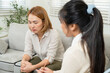 © Ekkasit A Siam - Single asian mother looking concerned during psychological consultation with professional asian female therapist in calm therapy room discussing behavior and emotional development of child
