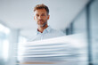 © Levan - professional manager holding important documents with ar blurred white text bars for modern touch