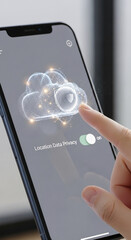 Wall Mural - smartphone displaying a cloud with shield graphic, finger activating location data privacy, showcasi