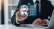 © sujon1638 - Professional businessman interacting with a futuristic holographic shield interface displaying security metrics and data points on a digital screen
