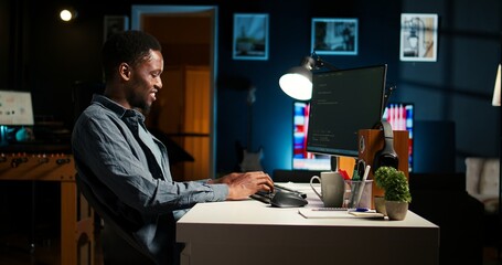 african american man working on pc to write code and programming in artificial intelligence and deep