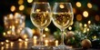 © bborriss - Two glasses of white wine celebrating christmas holidays with festive bokeh lights