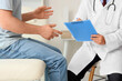 © Pixel-Shot - Young man visiting doctor in clinic. Prostate cancer awareness concept