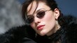 © BOJOShop - Close up portrait of a young woman wearing oval sunglasses and elaborate earrings