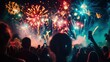 © Tima - A crowd watches a vibrant fireworks display at night. Colorful explosions light up the sky, creating a festive atmosphere.