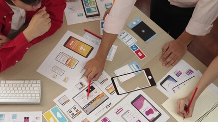 Wall Mural - top view panorama video of startup company employee planning on user interface prototype for mobile 