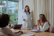 © bernardbodo - Doctor holding a presentation in the glass office